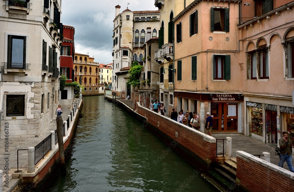 Toursits and the canal of Venice
