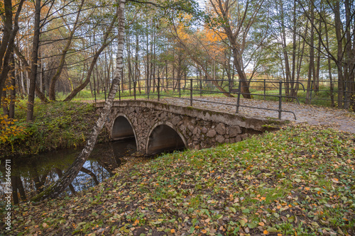 Beautiful scenery in Belarus. Magnificent autumn in the European city. A beautiful bridge across the river autumn.