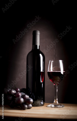 wineglass and bottle with grape