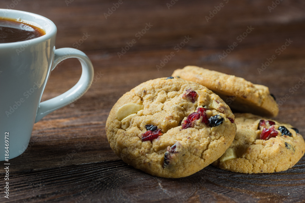 Coffee cup and cookies composition on rustic wooden background Coffee cup and cookies composition on rustic wooden background