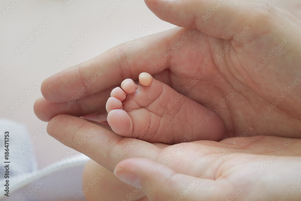 child's leg in my hands child's leg in my hands