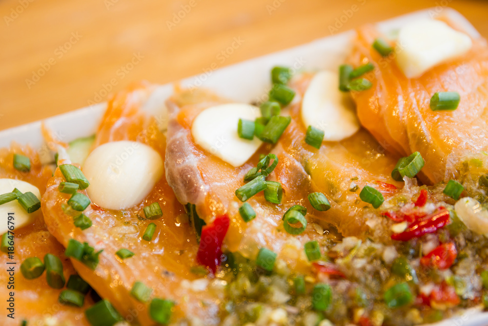 Spicy fresh sliced salmon sashimi close up. Spicy fresh sliced salmon sashimi close up.