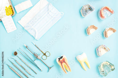 dentist tools and prosthodontic on color background, flat lay, top vipw. photo