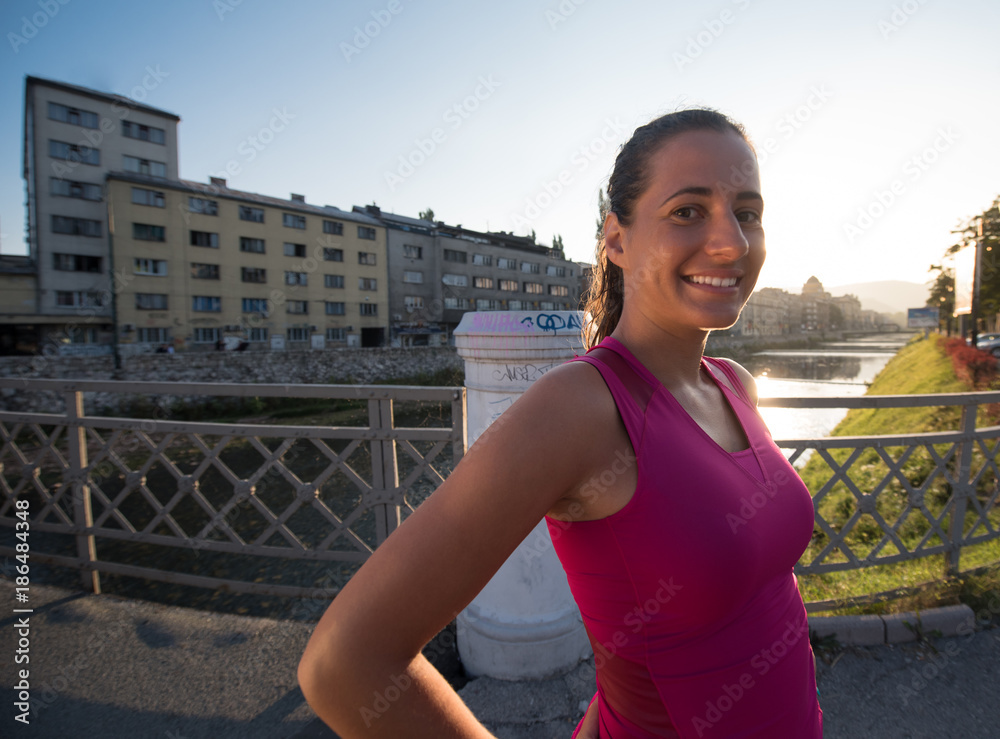 Fototapeta premium portrait of a jogging woman at sunny morning