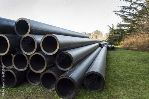 stack of PVC water pipes
