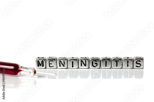 Syringe and blood with the word meningitis on beads photo