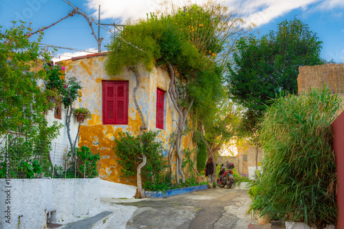 Fototapeta Naklejka Na Ścianę i Meble -  Street of Anafiotika in the old town of Athens, Greece. Anafiotika is district built by workers from the island Anafi. Popular tourist attraction.