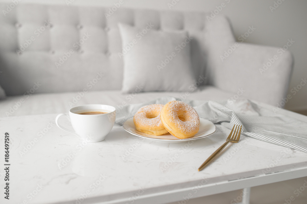 Classic donut. Morning breakfast on table in living room at home. Classic donut. Morning breakfast on table in living room at home.