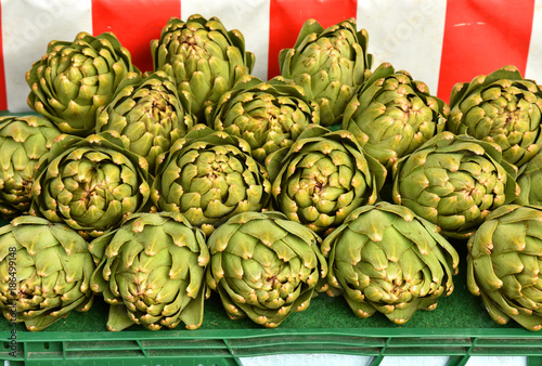  Vegetable background with fresh artichokes.Artichokes in the market.