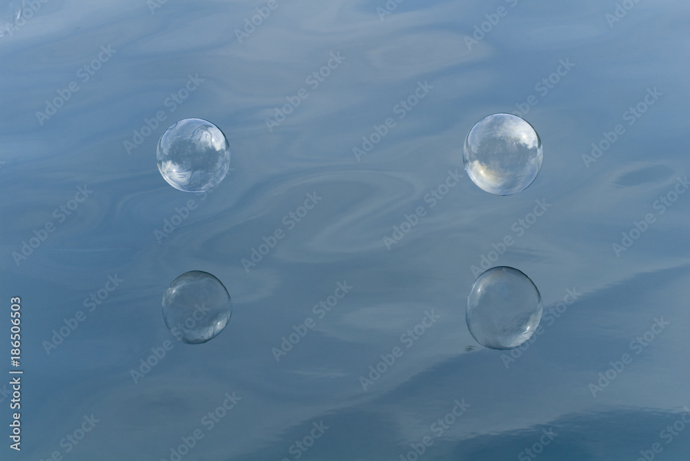 Soap bubbles over water