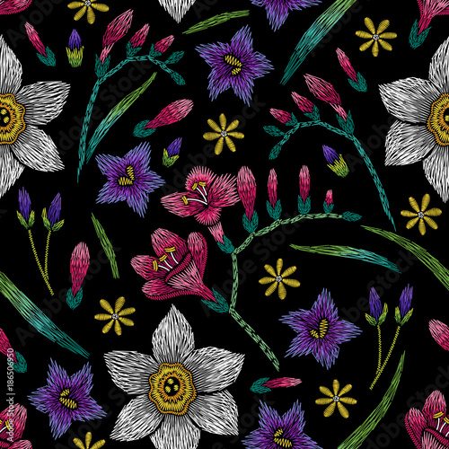 Fototapeta Naklejka Na Ścianę i Meble -  Embroidery seamless floral pattern with narcissus, freesia and bellflower