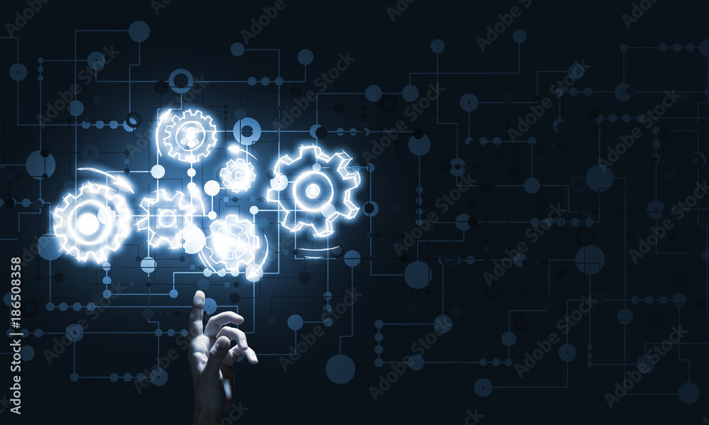 Glowing cogwheel mechanism icon on dark background as symbol of teamwork Glowing cogwheel mechanism icon on dark background as symbol of teamwork