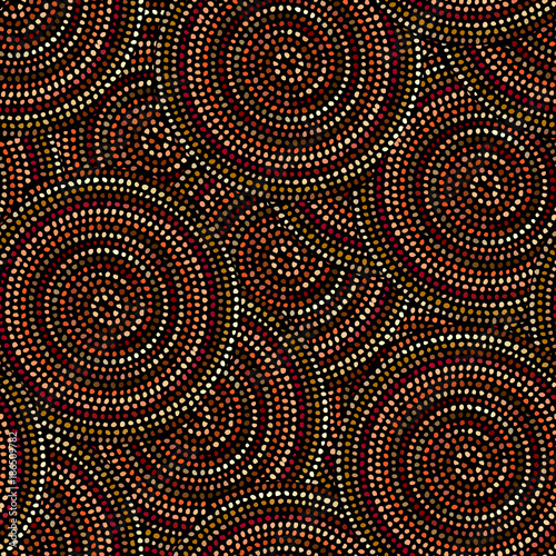Ethnic boho seamless pattern in african style on black background. Tribal art print. Irregular polka dots pattern.