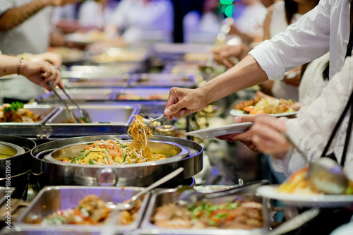 scooping the food. Buffet food at restaurant. Catering food