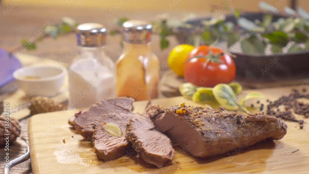 Close up of sliced roasted meat with spices. Meat in the home kitchen. Making meat Close up of sliced roasted meat with spices. Meat in the home kitchen. Making meat