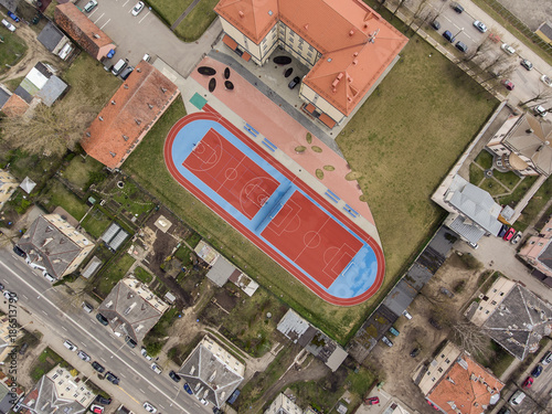 Aerial view over basketball field in Zirmunai district, capital city Vilnius, during cloudy Autumn day. photo