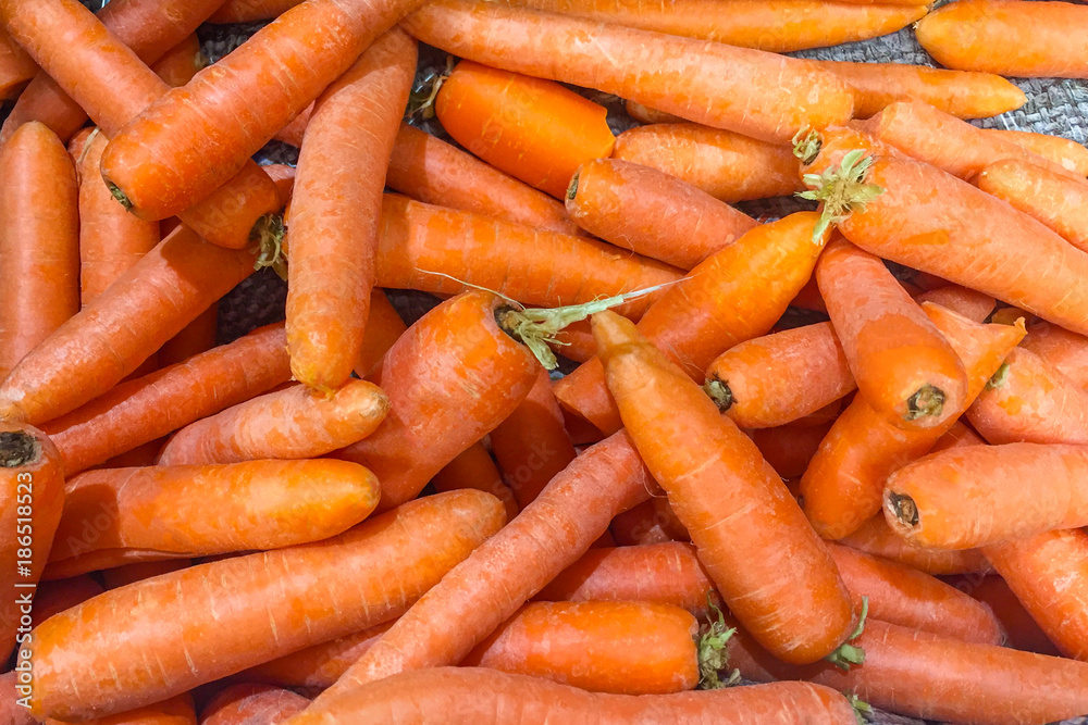 A pile of carrots (closeup view, background) A pile of carrots (closeup view, background)