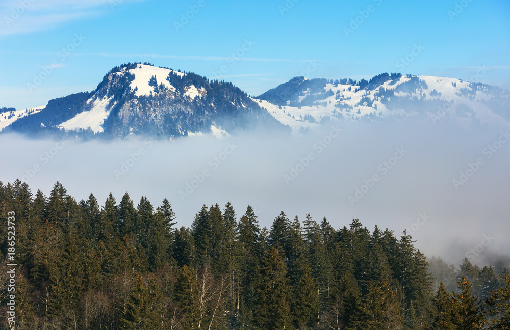 Fog in mountains - a wintertime view from the village of Stoos in the Swiss canton of Schwyz