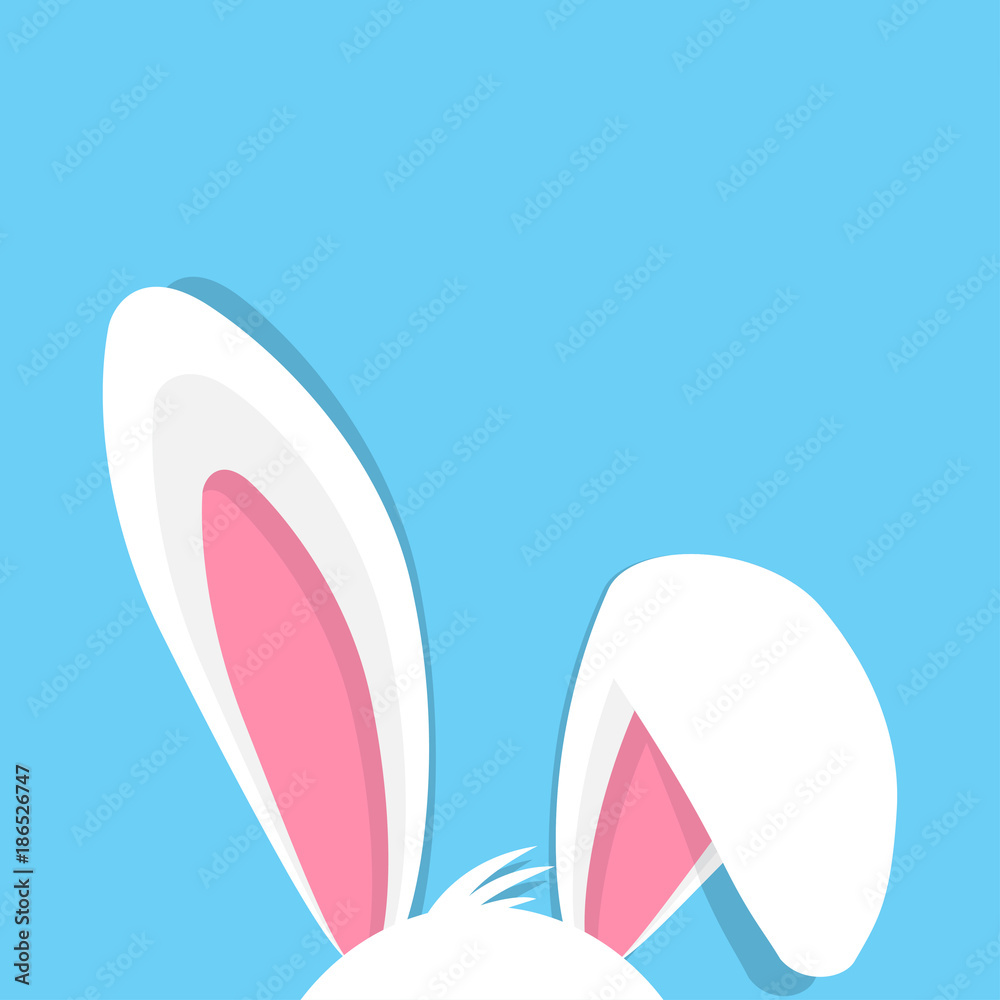 Obraz premium Wesołych Świąt z uszami królika na niebieskim tle