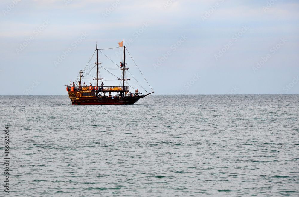 An entertaining pirate ship for tourists sailing on the sea An entertaining pirate ship for tourists sailing on the sea