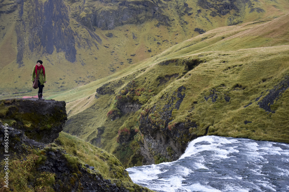 Elf at the waterfall in Iceland - Skógafoss