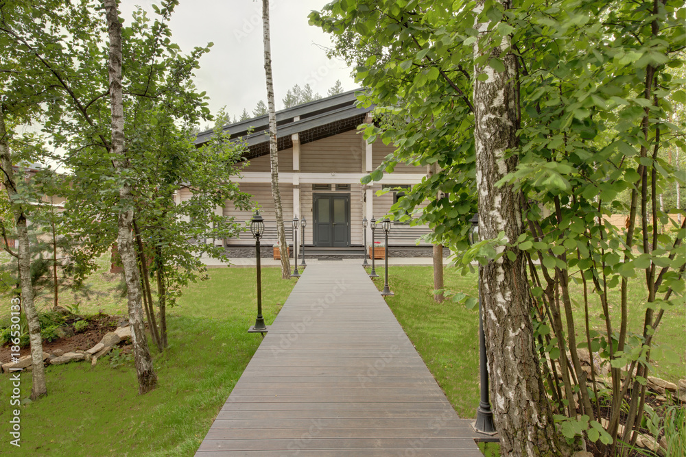 The wooden flooring conducting to the building where there is a bath and a sauna The wooden flooring conducting to the building where there is a bath and a sauna