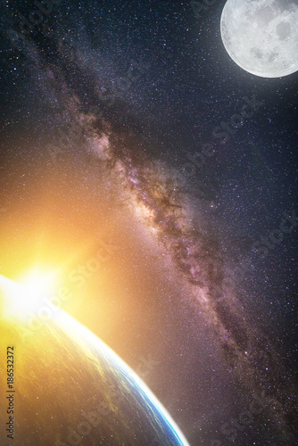 Landscape with Milky way galaxy. Sunrise and Earth view from space with Milky way galaxy and full moon. (Elements of this image furnished by NASA)