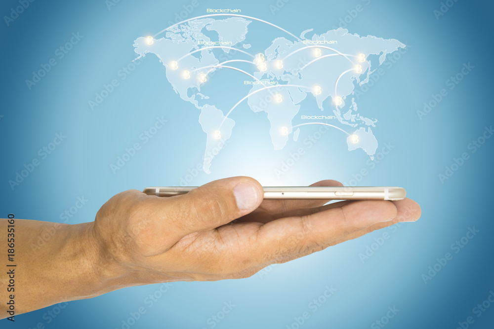 Hand holding smart phone with connexions on a world map. Finance and crypto currency security concept Hand holding smart phone with connexions on a world map. Finance and crypto currency security concept