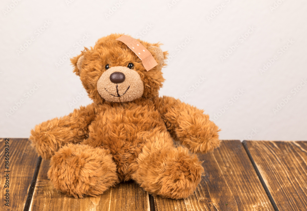 teddy bear with a plaster teddy bear with a plaster