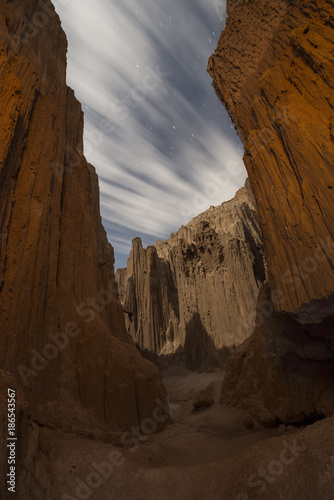 Scenic view of slot canyons against cloudy sky at Cathedral Gorge State Park photo