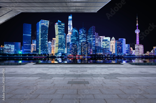 Photography Panoramic empty floor with modern business office building at night