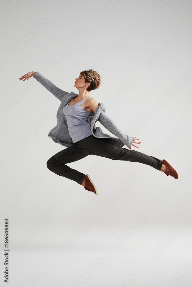 Passionate modern dancer woman working out at studio