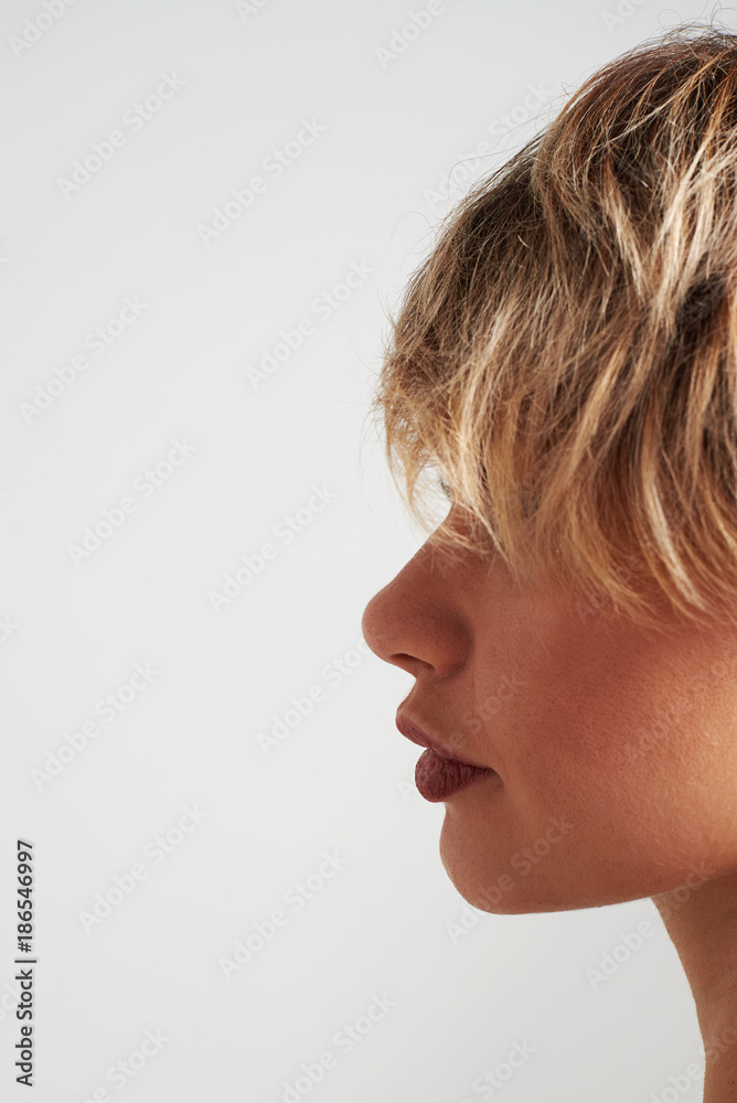Fashion girl with short hair posing at studio Fashion girl with short hair posing at studio