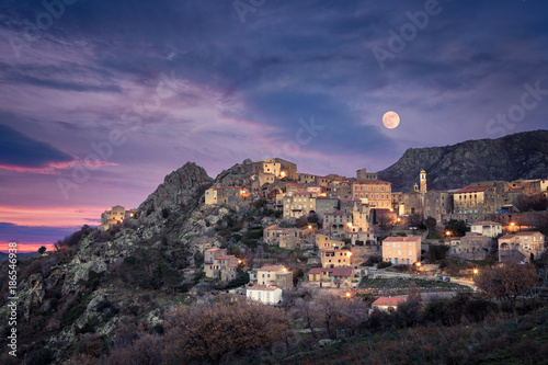 Full moon over Balagne village of Speloncato in Corsica