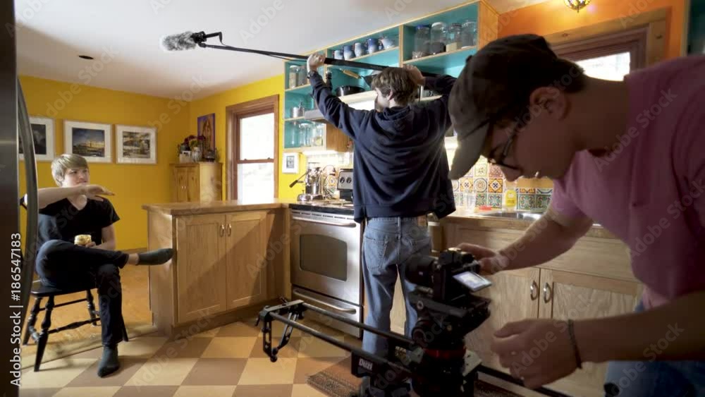 Movie set with teen filmmaker, teen audio engineer, and teen actor. Movie set with teen filmmaker, teen audio engineer, and teen actor.