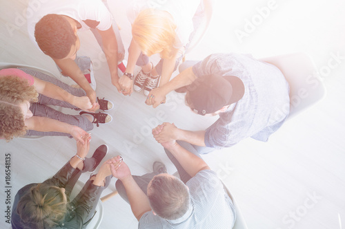 Young people holding hands
