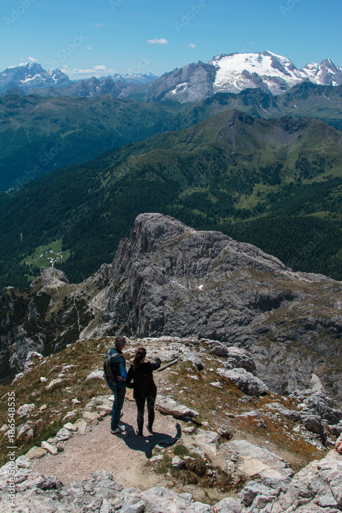 Young Couple Admire Italian Dolomites Alps Scenery