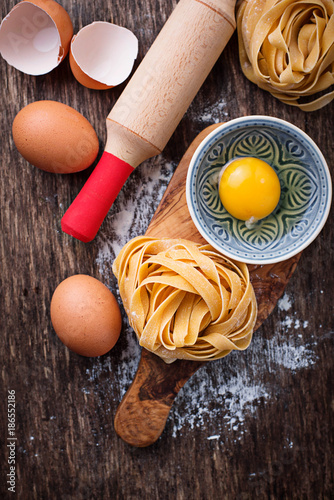 Raw pasta tagliatelle and eggs