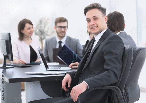 business team with a senior Manager in the foreground