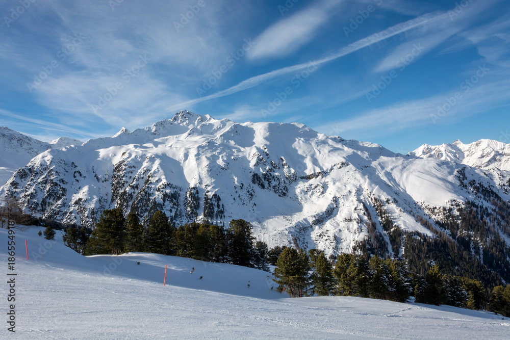 Fototapeta premium Slope in ski resort Serfaus Fiss Ladis in Austria with snowy mountains