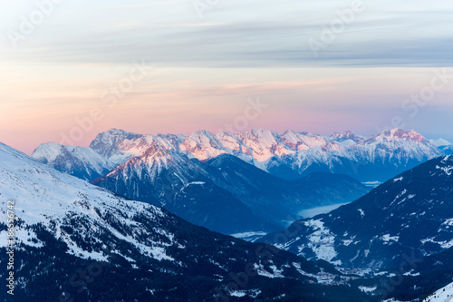 Snowy mountains with the "Zugspitze" the hightest mountain in Germany with pink sky