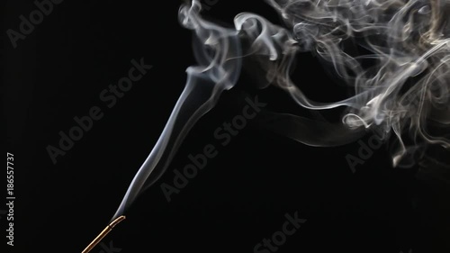 A burning Indian incense with amazing smoke patterns