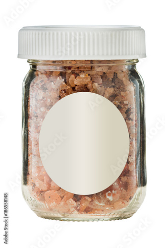 Hot smoked chili salt in glass on white background