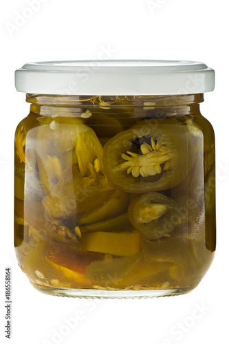 Hot jalapeno chili slices in glass on white background