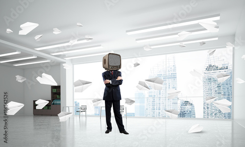 Businessman with an old TV instead of head. © adam121