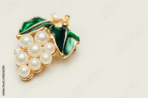 jewelry brooch with green leaves