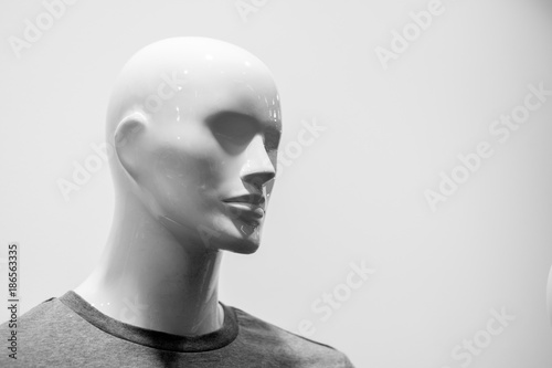 Close-up of a plastic mannequin head. Black and white