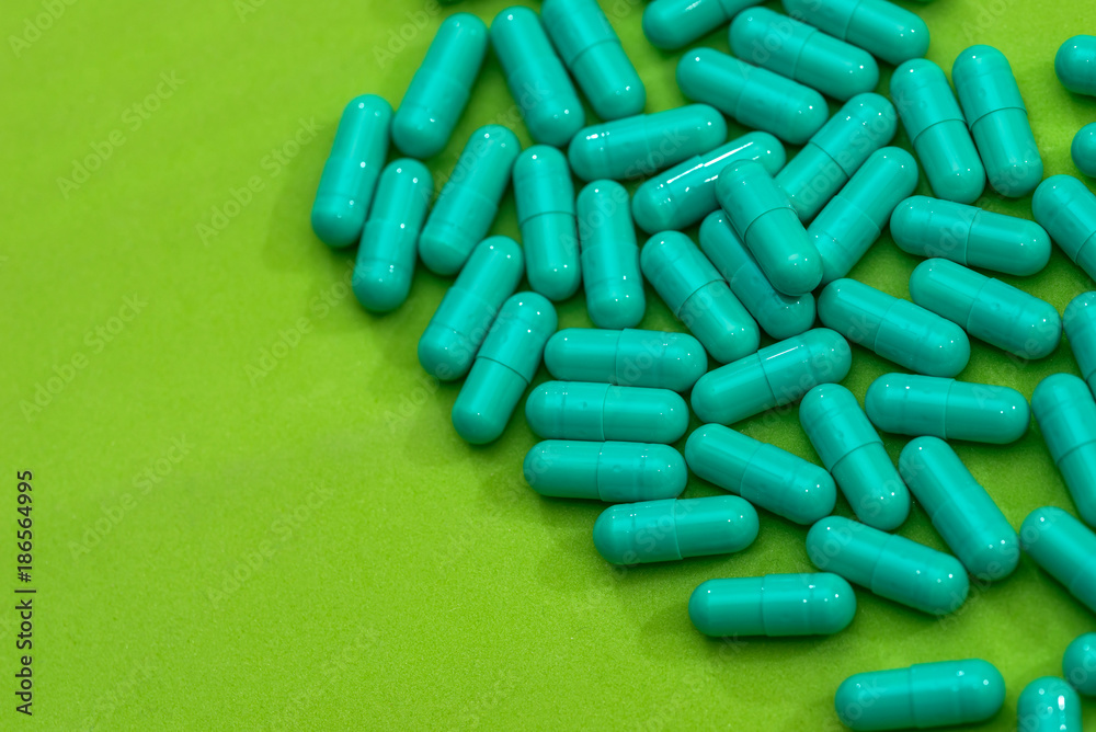 Green capsules are a big plan - close up Green capsules are a big plan - close up