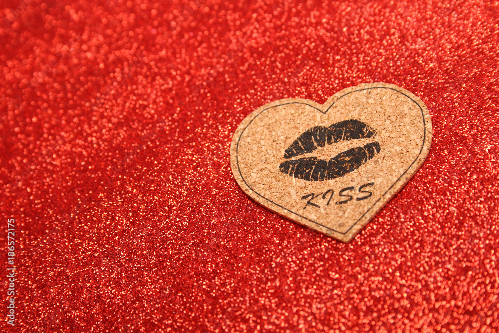 Red background with image of lip pattern and text kiss Red background with image of lip pattern and text kiss
