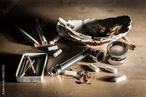 Quadro em tela Pipe and other utensils for smoking marijuana and rolling spliffs - problem of illegal soft recreational drugs use